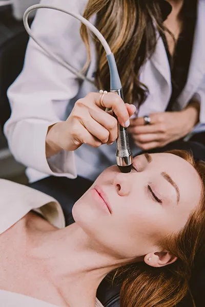 Dr. Balvinder Bharj treating a patient using radiofrequency